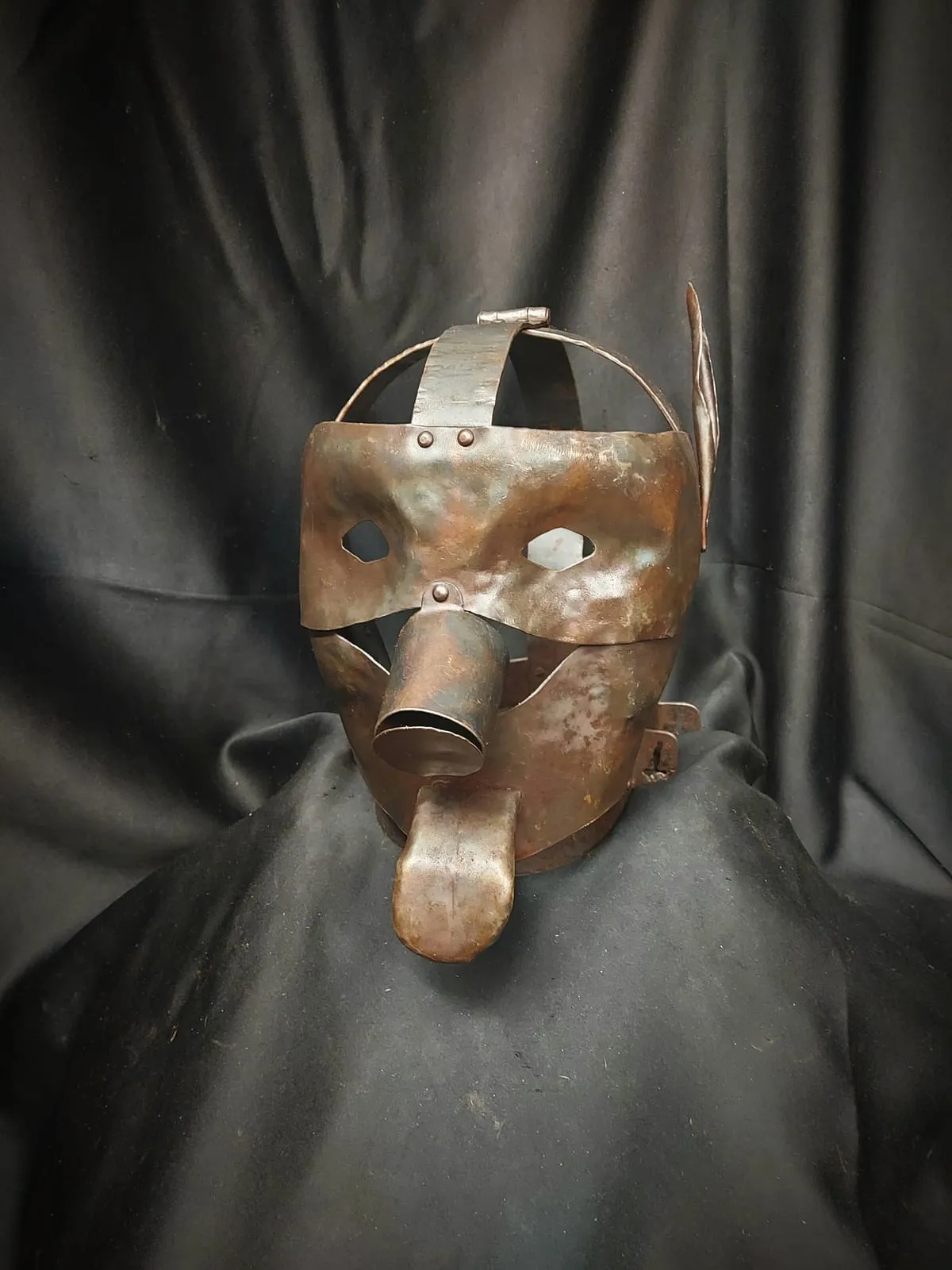 Metal shame mask from the medieval torture props set