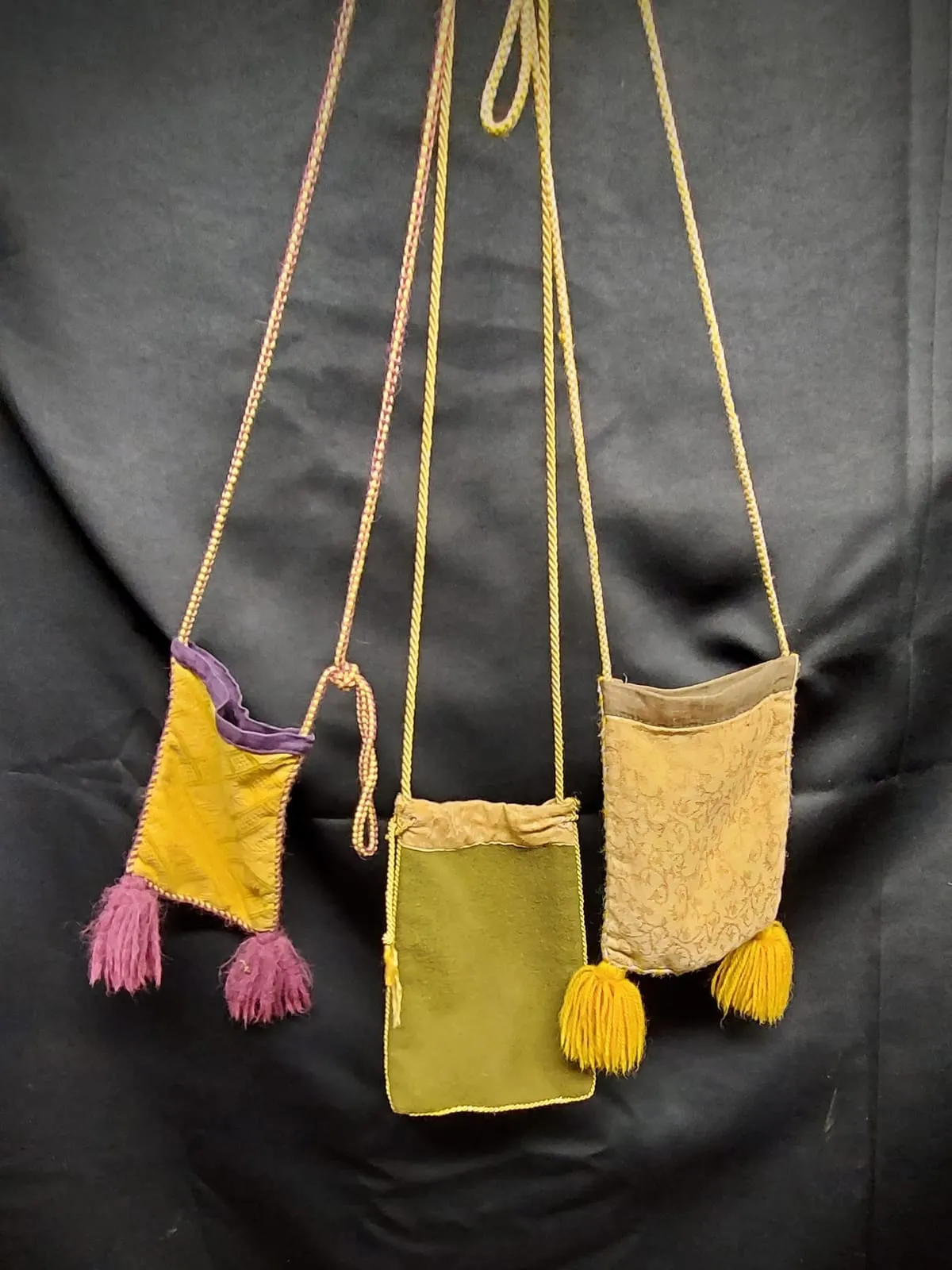 Colourful fabric pouches with cords and tassels